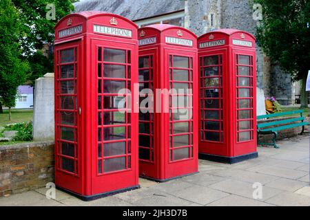 Three Red Telephone boxes Essex Stock Photo