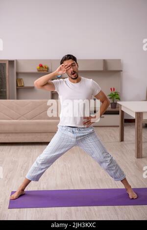 Young man doing sport exercises in the morning Stock Photo