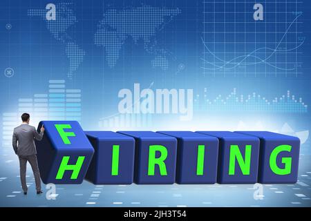 Hiring and firing concept with the turning cubes Stock Photo - Alamy
