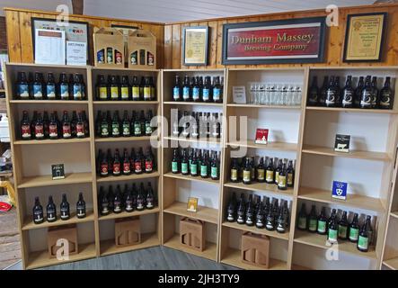 The Dunham Massey Brewing Company shop, shelves of bottled ale, Dunham village, Bowden, Altrincham, Cheshire, England, UK, WA14 4PE Stock Photo