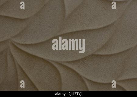 Beige ceramic tile with leaves pattern for wall and floor decoration. Concrete stone surface background. Texture for interior design project Stock Photo