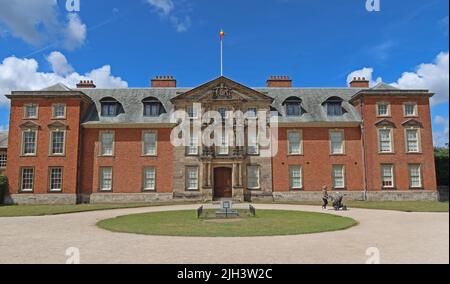 Dunham Massey Hall NT flying the Ethiopian flag on a sunny summer day near Altrincham, Cheshire, England, UK. WA14 4SJ Stock Photo