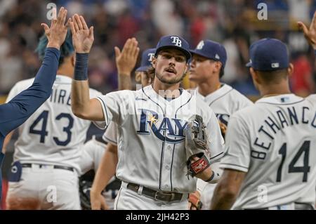 Tampa Bay Rays' Josh Lowe, left, tugs on the jersey of his brother Texas  Rangers' Nathaniel Lowe after flying out during the seventh inning of a  baseball game Sunday, June 11, 2023