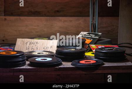 May 13 2022 South Haven MI USA ; stacks of dusty old 45 records are for sale at an antique barn Stock Photo