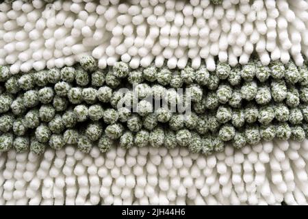 Fluffy fake textile fur. White shaggy blanket texture as background. Stock Photo