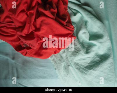 red and light green fabric texture useful as a background Stock Photo