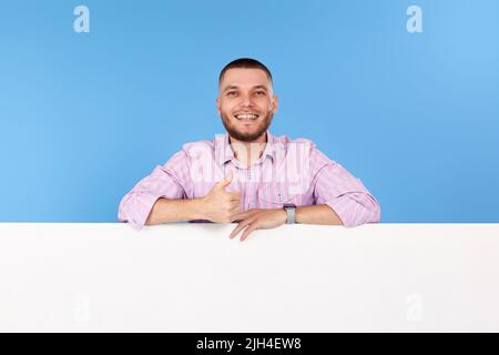 cheerful man holding board with empty copy space Stock Photo