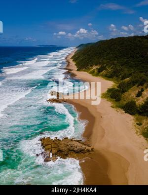 St Lucia South Africa, Rocks sand ocean, and blue coastal skyline at Mission Rocks beach near Cape Vidal in Isimangaliso Wetland Park in Zululand. South Africa St Lucia Stock Photo