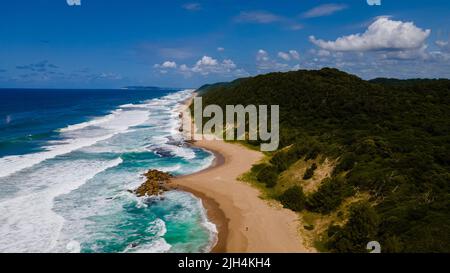 St Lucia South Africa, Rocks sand ocean, and blue coastal skyline at Mission Rocks beach near Cape Vidal in Isimangaliso Wetland Park in Zululand. South Africa St Lucia Stock Photo