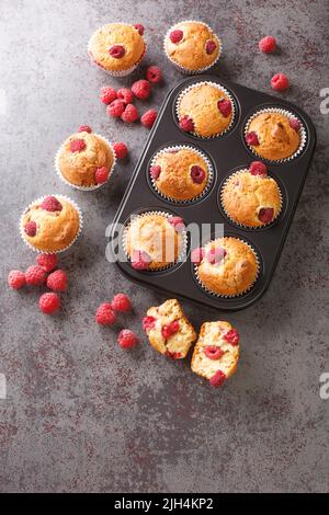 Vegan Gluten free raspberry muffins closeup on the table. Vertical top view from above Stock Photo