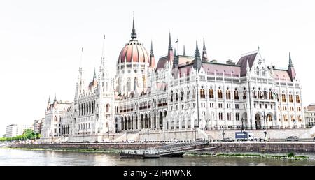 Looking at the iconic Hungarian parliament building -Országház, corner on, from the other side of the Danube in Budapest. Stock Photo