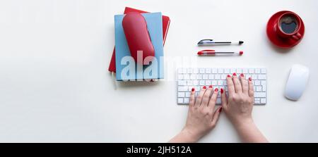 Office desktop with copy space. Woman hands on laptop keyboard Stock Photo