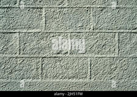 Pattern of large blocks of a block work wall all painted the same colour Stock Photo