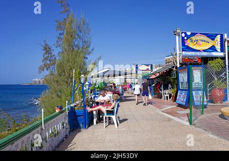 Tourists on the sea promenade, Arguineguin, Grand Canary, Canary islands, Spain, Europe Stock Photo