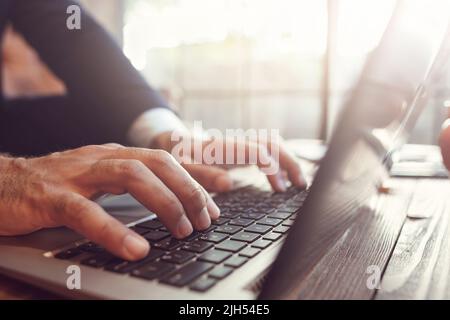 businessman working at laptop on sunset. Stock Photo