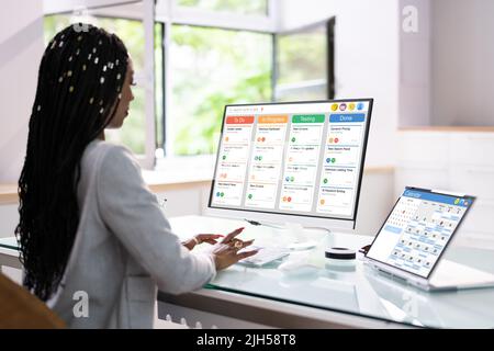 Kanban Project Management Software On Laptop. Digital Calendar Schedule Stock Photo