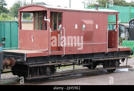 A Traditional Railway Guards Van on a Freight Train. Stock Photo