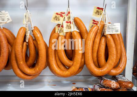 Sausages or charcuterie hanging up for sale in a shop in Spain Stock Photo