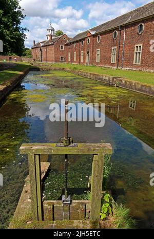 Dunham Massey, NT hall , moat, sluice  and gardens, Dunham town, Bowden, Altrincham, Cheshire, England, UK,  WA14 4SJ Stock Photo