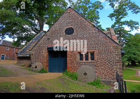 Dunham Massey, NT mill with grinding wheel, Dunham town, Bowden, Altrincham, Cheshire, England, UK,  WA14 4SJ Stock Photo