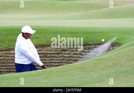 USA's Tiger Woods chips out of a bunker on the 16th during day two of The Open at the Old Course, St Andrews. Picture date: Friday July 15, 2022. Stock Photo