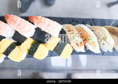 sushi or engawa sushi or fish sushi and egg sushi , rice topped with engawa and shrimp sushi or prawn sushi or steam egg rolls or fish rolls Stock Photo