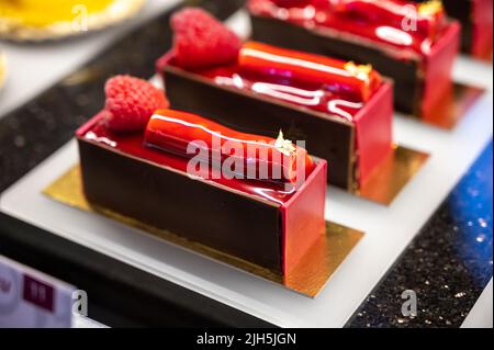 Austrian desserts, different types of chocolate and fruit cakes on display in cafe in Vienna. Stock Photo