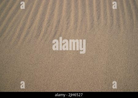 sand texture. wavy sand textured background. sand textured beach Stock Photo