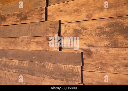 Old grunge dark textured wooden background on sunlight Stock Photo