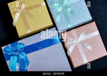 Multi colored gift boxes with bows different colors Stock Photo