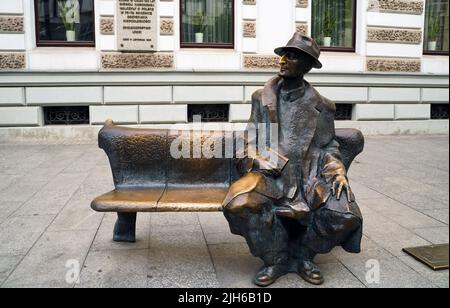 Lodz, Poland - July 08, 2022: Monument bench of famous poet Julian Tuwim on Piotrkowska street Stock Photo