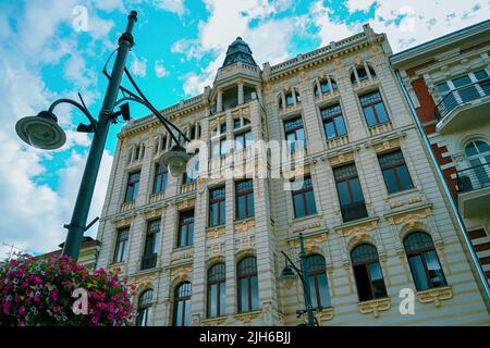 Lodz, Poland - July 08, 2022: Famous Gold apartment building in piotrkowska street at the city center Stock Photo