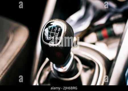 Manual gear lever of a car. Close up of a car gear stick manual transmission, Image of a car gear stick manual transmission Stock Photo