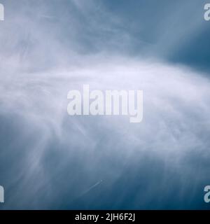 Abstract blue water texture with soft cloud reflections, creating a calm minimalist nature background. Stock Photo