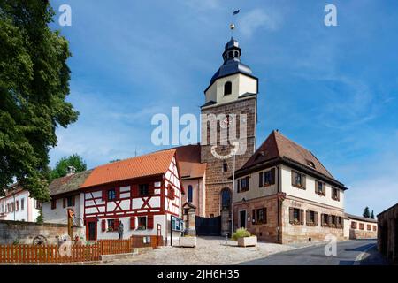 From left, fountain with local coat of arms sign, guard's house renovated, in front of it monument first tobacco cultivation 1670 in Gross Stock Photo