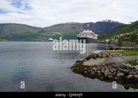 The Cunard Line cruise ship Queen Mary 2 is docked in Olden in Nordfjord, Norway. Stock Photo