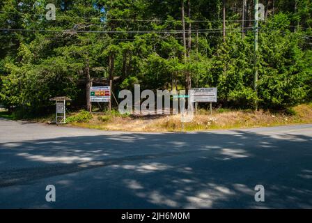 Fire hazard and RCMP signs at North Pender Island, British Columbia, Canada Stock Photo