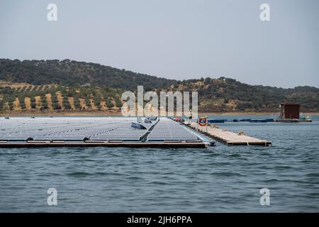 View of the photovoltaic panels at the floating solar power plant in Alqueva. Inaugurated on the 15th of July, this plant is ready to supply energy to more than 30% of the population of Moura and Portel regions, in the south of Portugal. With close to 12,000 photovoltaic panels occupying 4 hectares, the floating solar power plant is located at Alqueva Dam and has an installed power of 5 MW and the capacity to produce around 7.5 GWh per year.The plant is the largest in Europe at a reservoir. (Photo by Hugo Amaral/SOPA Images/Sipa USA) Stock Photo
