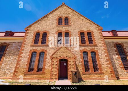 Wyoming, JUL 9 2022 - Sunny exterior view of the Wyoming Territorial Prison Stock Photo