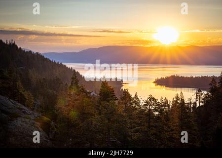 Just after sunrise on the Eagle Falls trail overlooking Emerald Bay Lake Tahoe Stock Photo