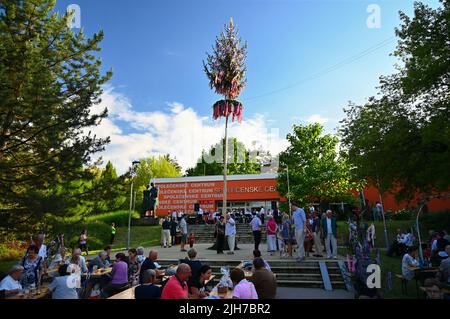 Brno - Bystrc, Czech Republic, June 25, 2022.  Traditional Czech feast. Folk Festival. Girls and boys dancing in beautiful costumes. An old Christian Stock Photo