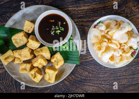 Tahu Goreng is popular street food of deep fried bean curd from Indonesia Stock Photo