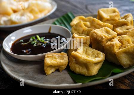 Tahu Goreng is popular street food of deep fried bean curd from Indonesia Stock Photo