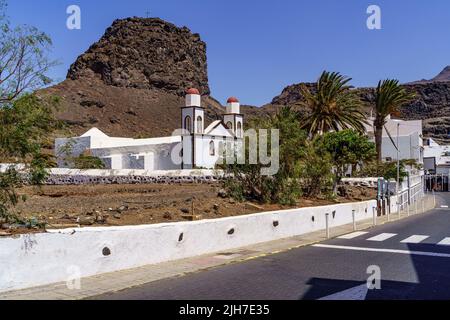 Small white stone church in a coastal town on the island of Gran Canaria. Agaete. Spain. Stock Photo