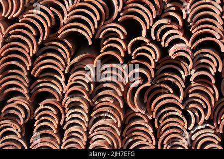 Old clay ceramic roofing tile stacked Stock Photo