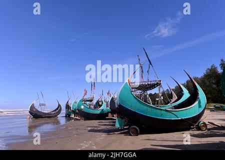Cox's Bazar. 16th July, 2022. Fishing boats are seen along the shore in Cox's Bazar, Bangladesh on July 13, 2022. Like previous years, Bangladesh banned fishing off its coast for 65 days from May 20 in order to help ensure smooth breeding of fish and boost depleted fish stocks. The once bustling fishermen's wharfs in places in Cox's Bazar, some 400 southeast of capital Dhaka, lie dormant, with dozens of fishing boats tied along the shores. Credit: Xinhua/Alamy Live News Stock Photo
