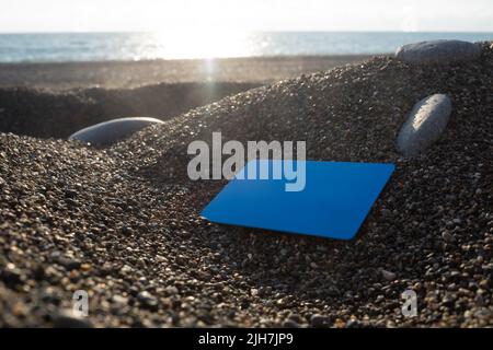 Empty Credit card on tropical beach close up view Stock Photo