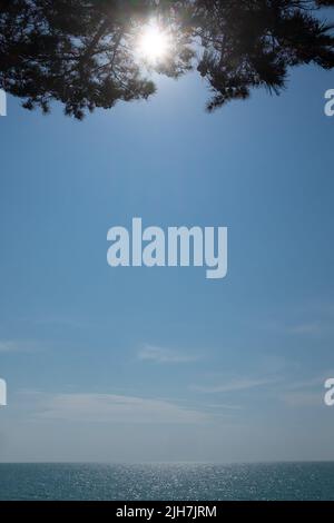 blue sea and cloudy sky on sunny summer day. Stock Photo