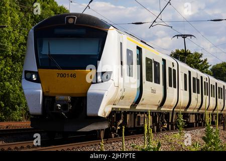 Thameslink Siemens Desiro Class 700 electric train on the East Coast Main Line at Offord Cluny, Cambridgeshire, England Stock Photo