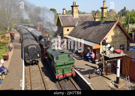 Double headed tank engines leaving Arley station bound for Kidderminster, as a Bridgnorth train awaits departure on the adjacent line. Stock Photo